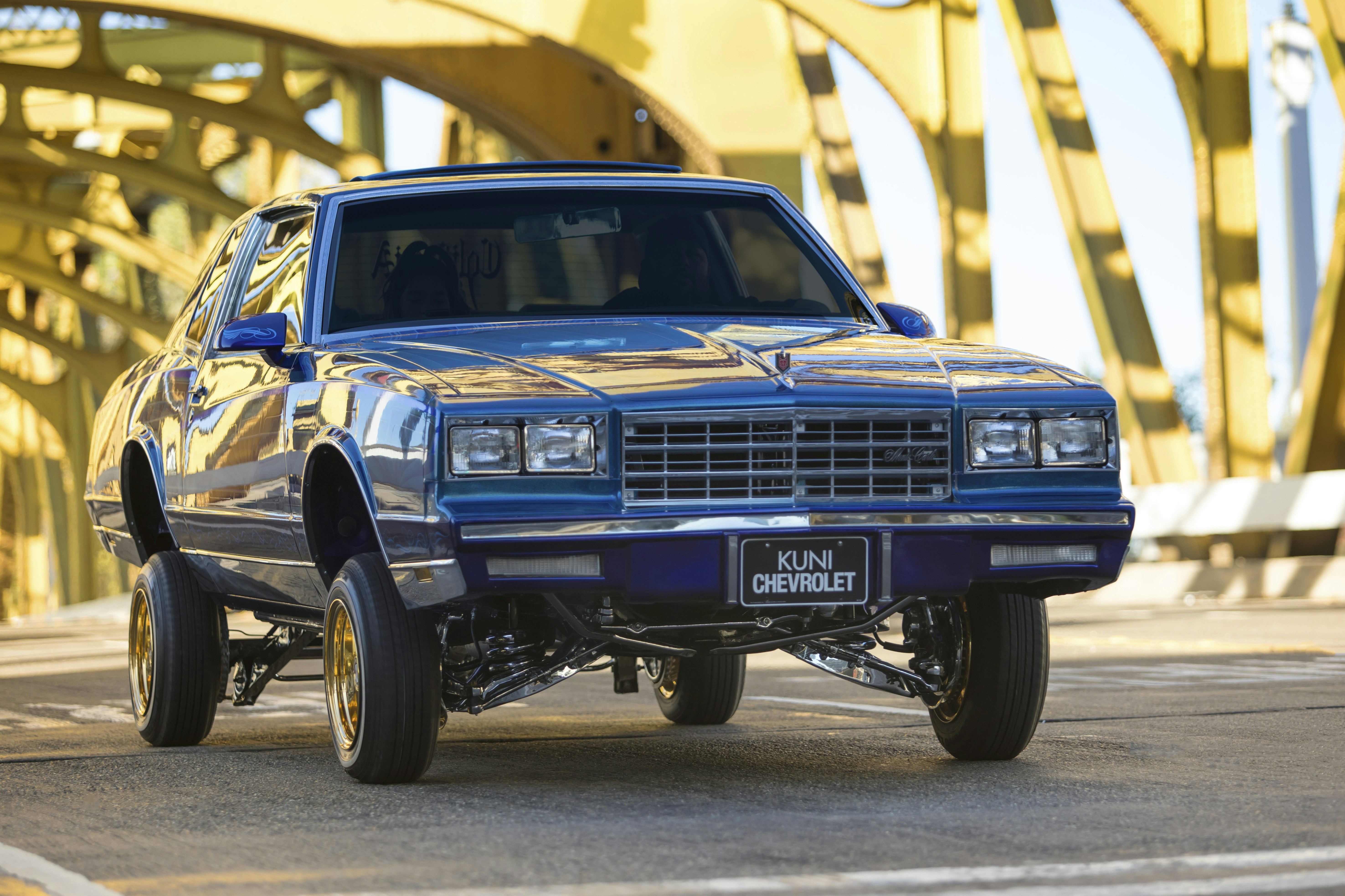 blue chevrolet car on road during daytime