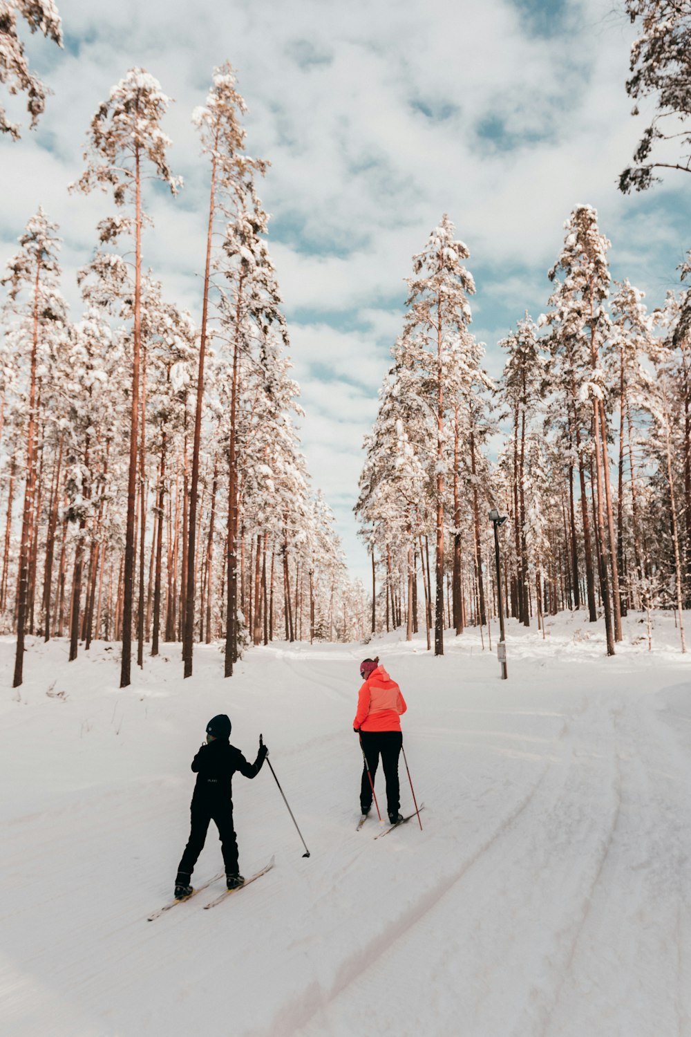 people walking on snow covered ground during daytime