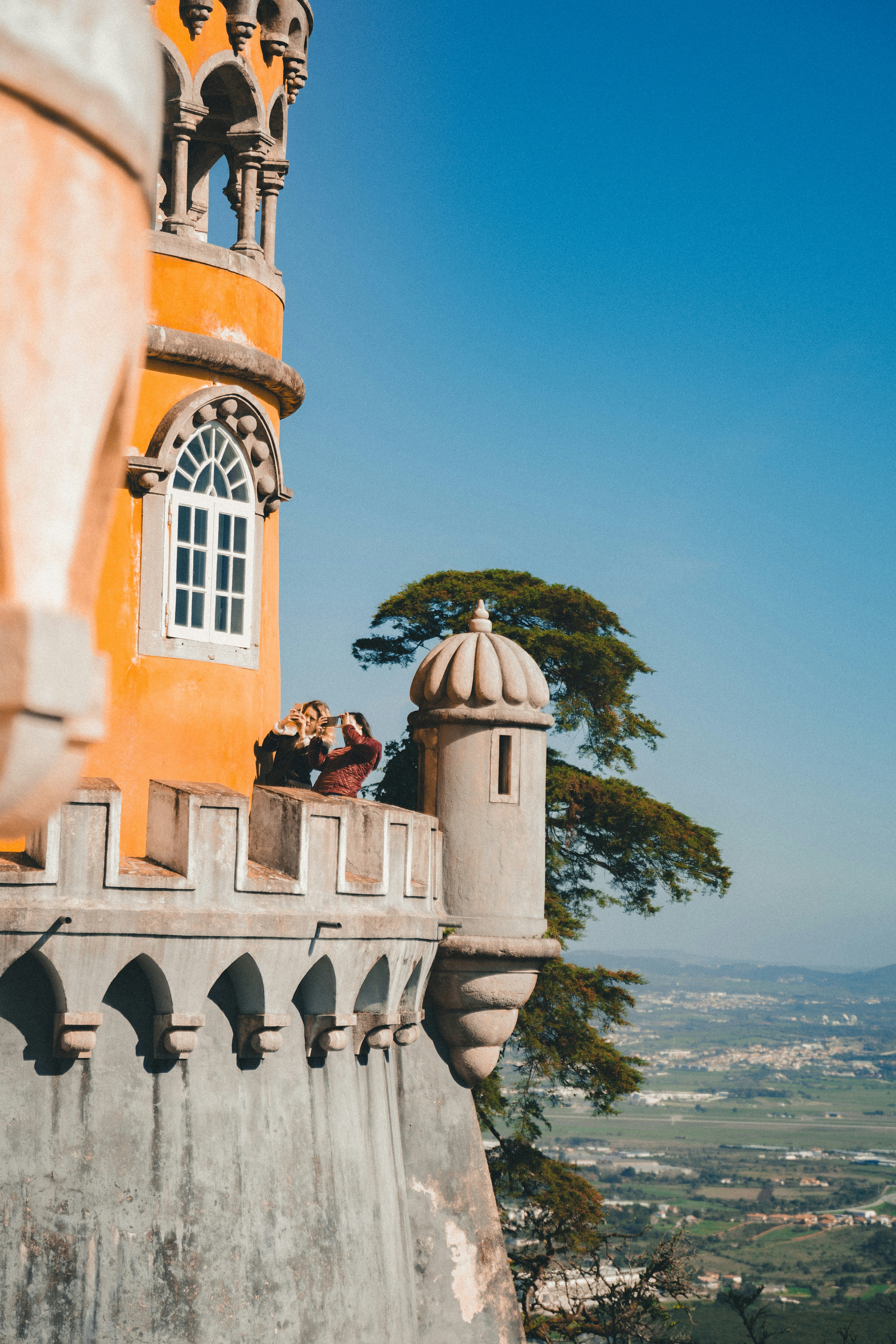 brown concrete building near body of water during daytime