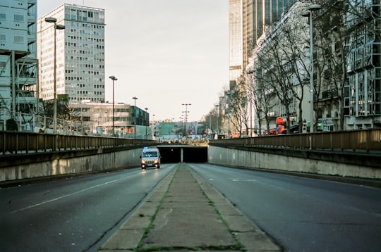gray concrete road near high rise buildings during daytime in Montparnasse France