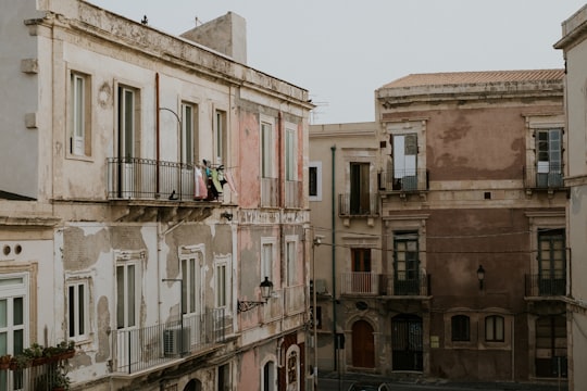 white concrete building during daytime in Siracusa Italy