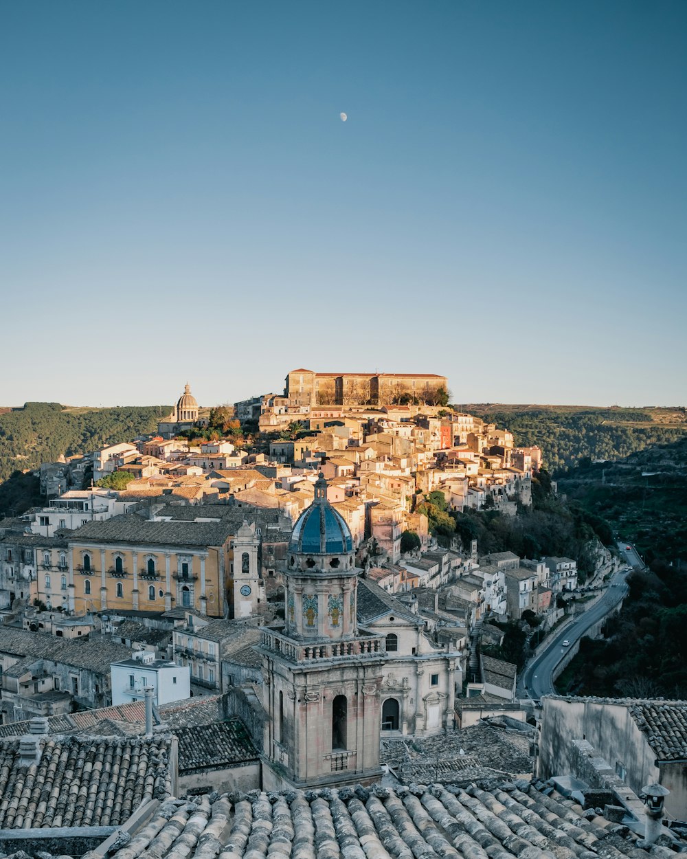 a view of a city with a hill in the background