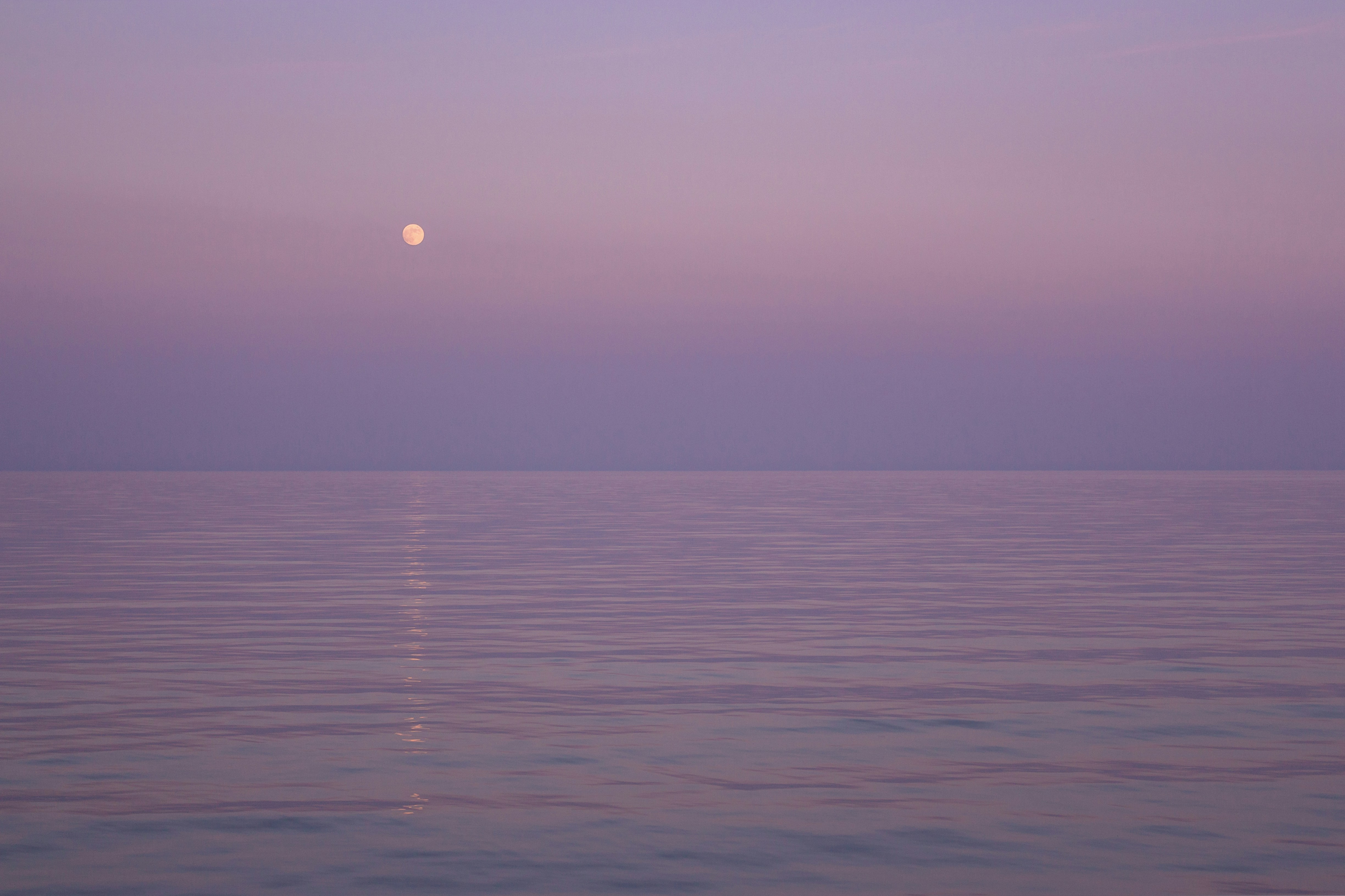 body of water during sunset