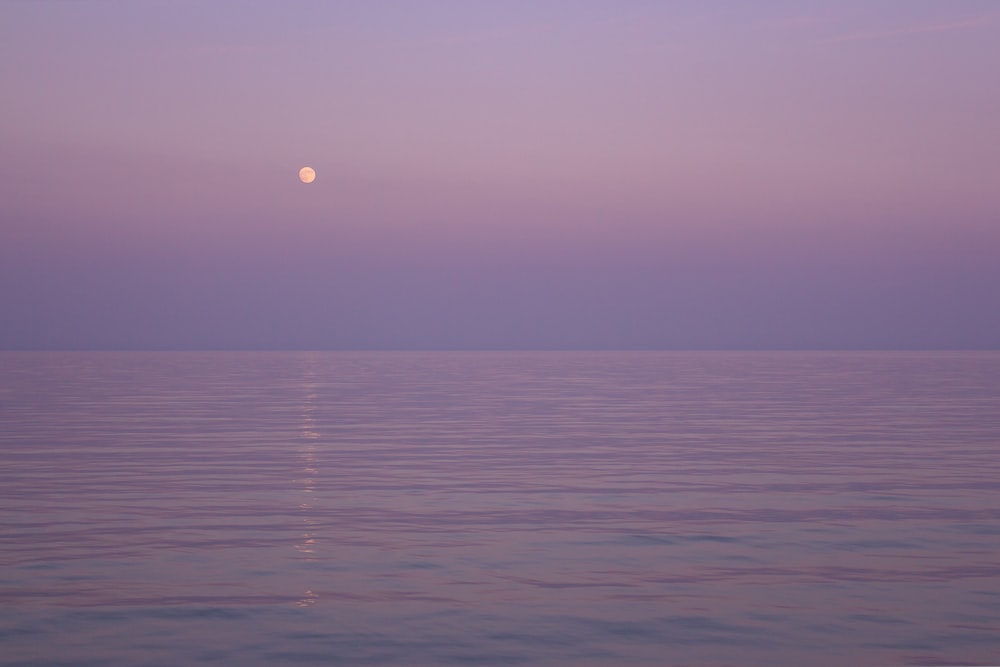 body of water during sunset