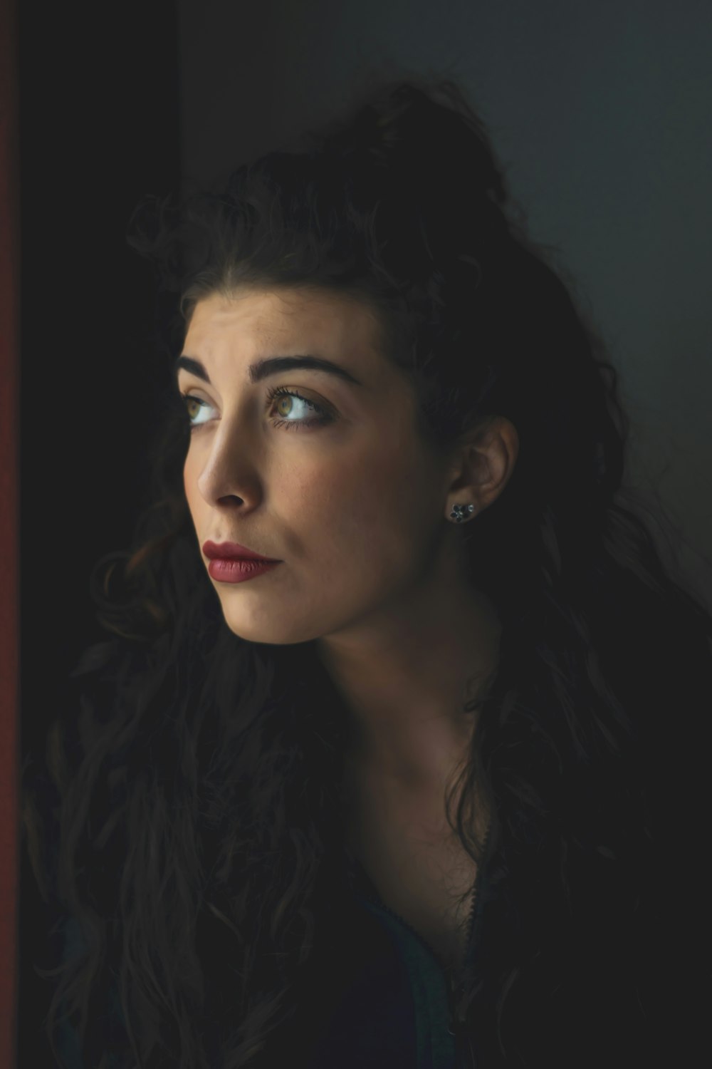 woman with black hair and red lipstick