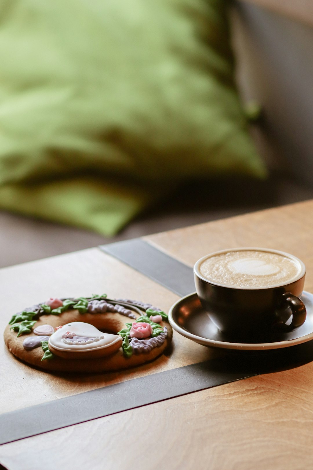 brown ceramic mug on brown saucer