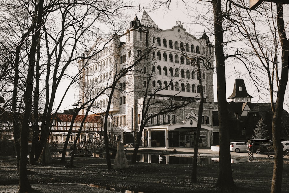 brown concrete building near bare trees during daytime