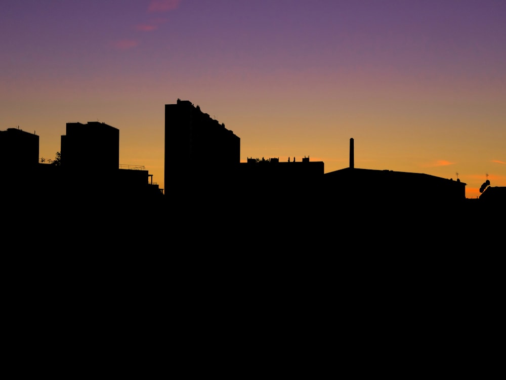 silhouette of building during sunset