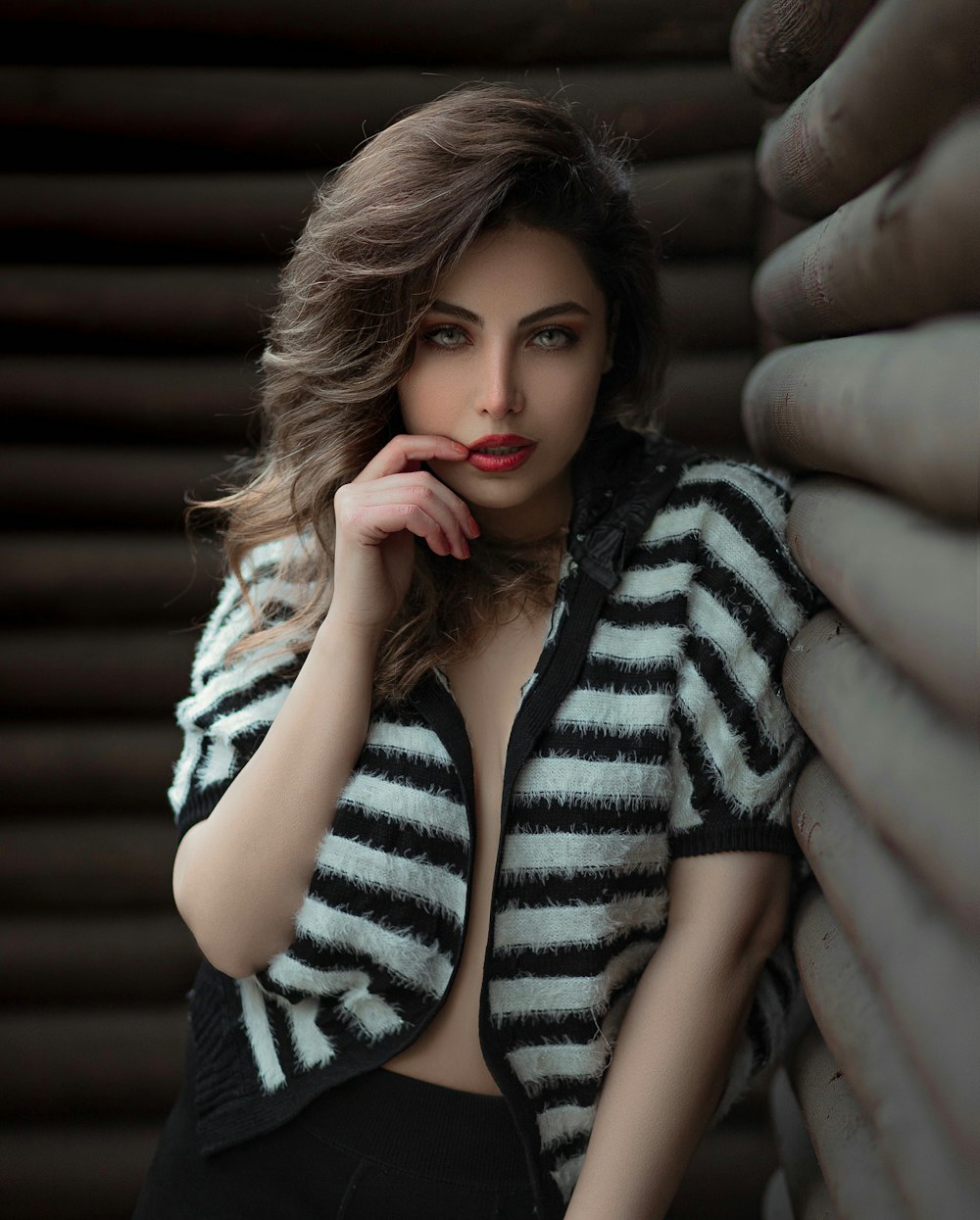 woman in black and white striped long sleeve shirt