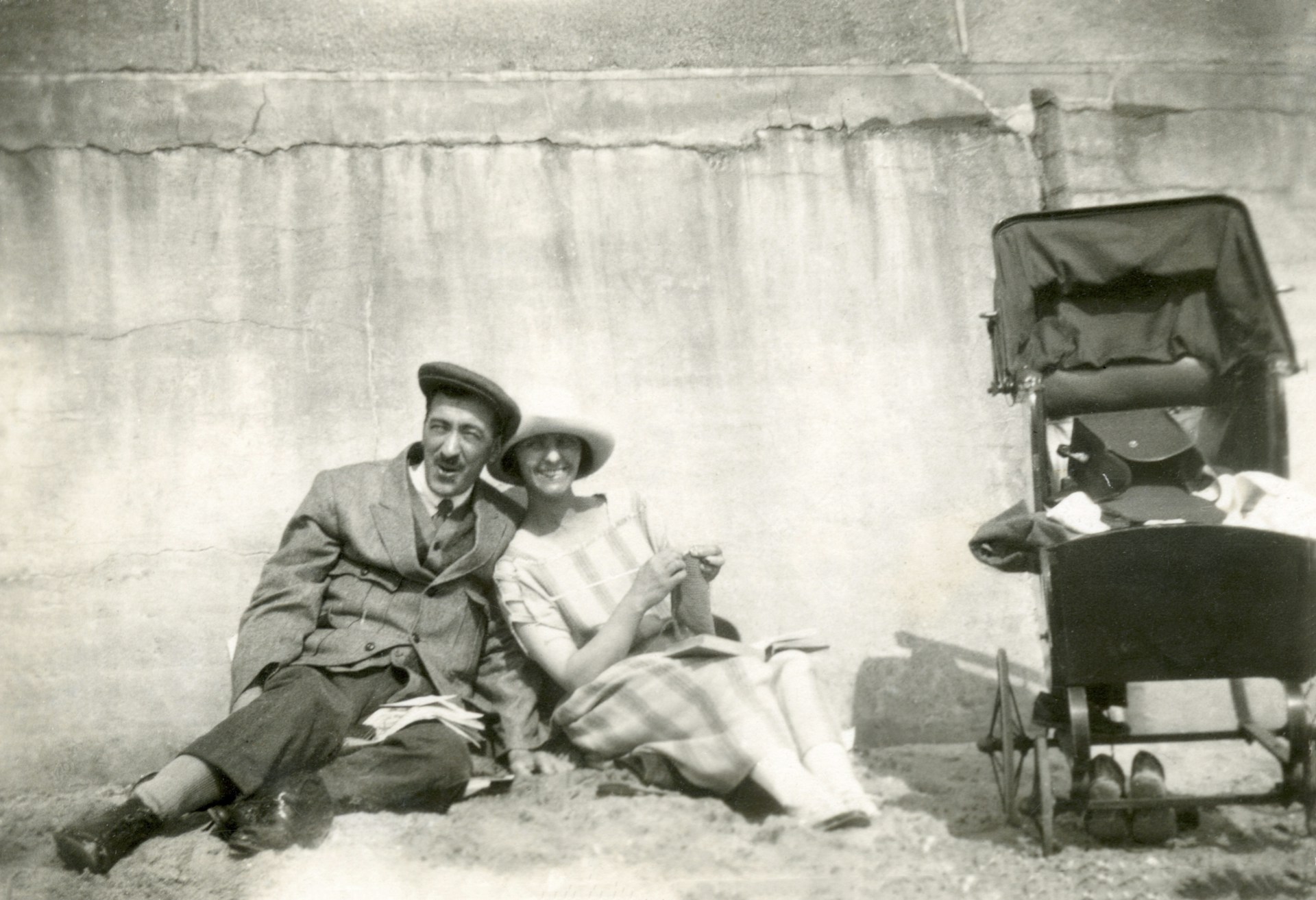 man and woman sitting on chair