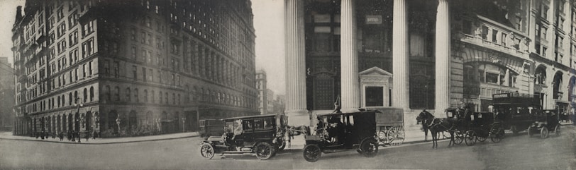 A vintage photograph of Buxton and Hollis town center from the early 1900s, showing historic buildings and main street activity.