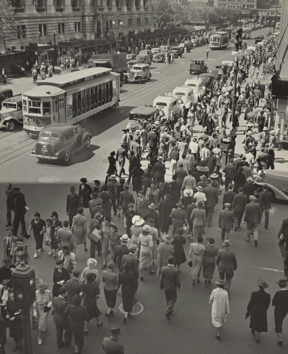 people walking on street during daytime in 1937