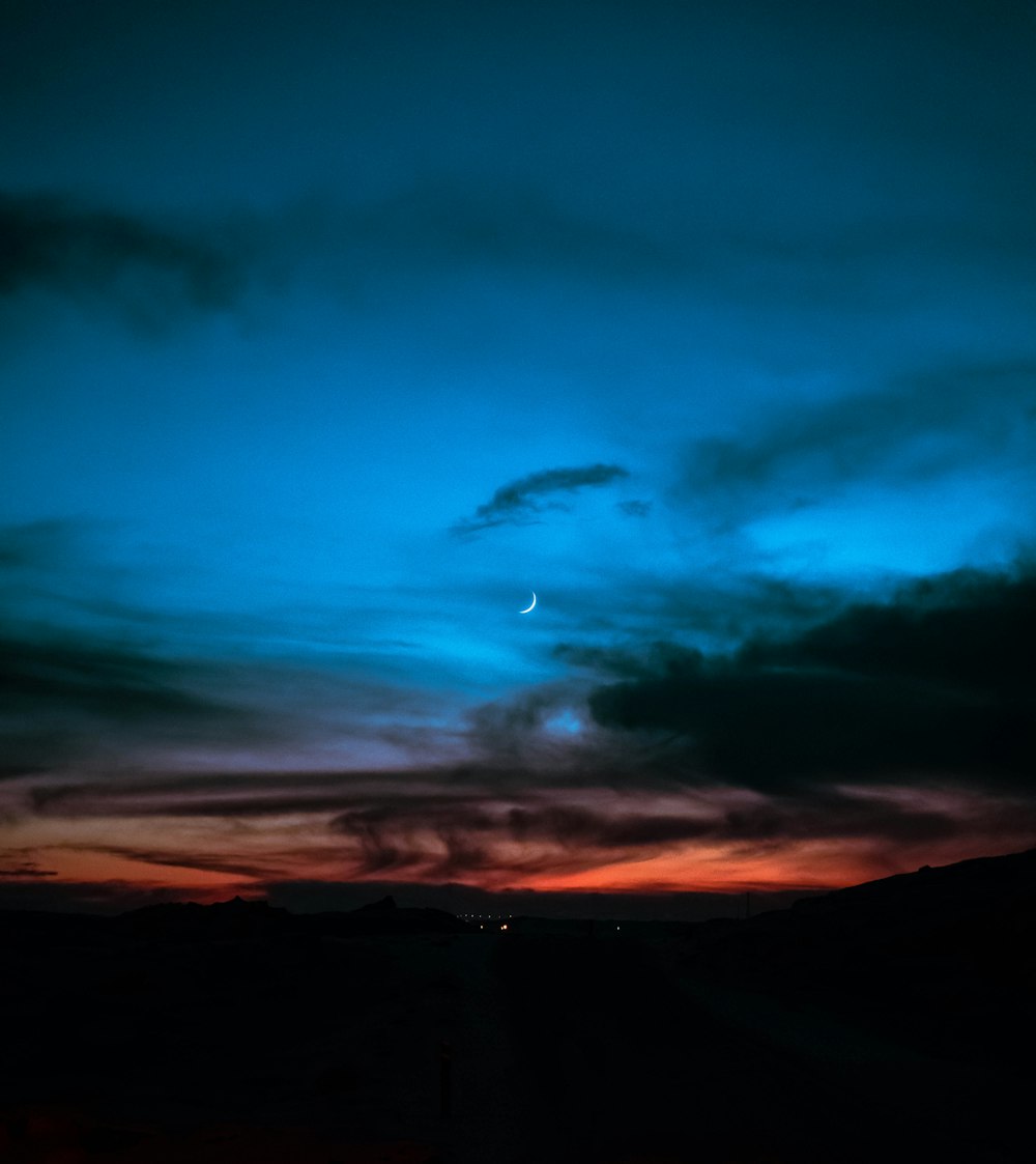 silhouette of mountains under blue sky