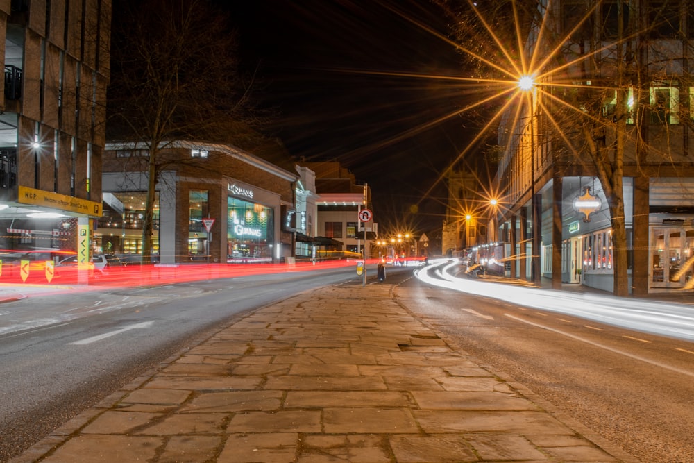 lighted street lights on road during night time