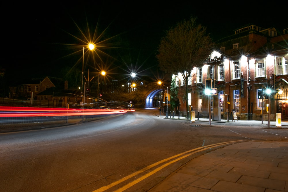 time lapse photography of cars on road during night time