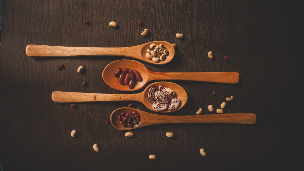 brown wooden spoon with brown and black beans