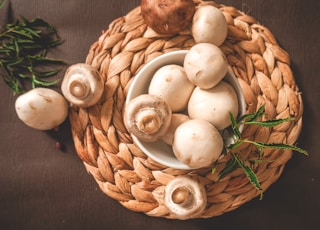 white garlic on brown woven basket