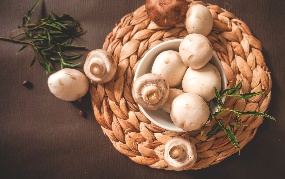 white garlic on brown woven basket