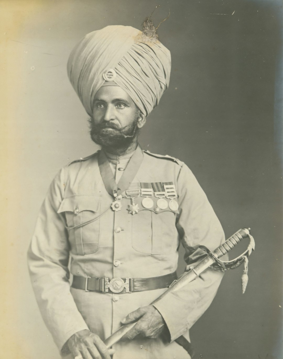 Man in military dress and turban in 1889