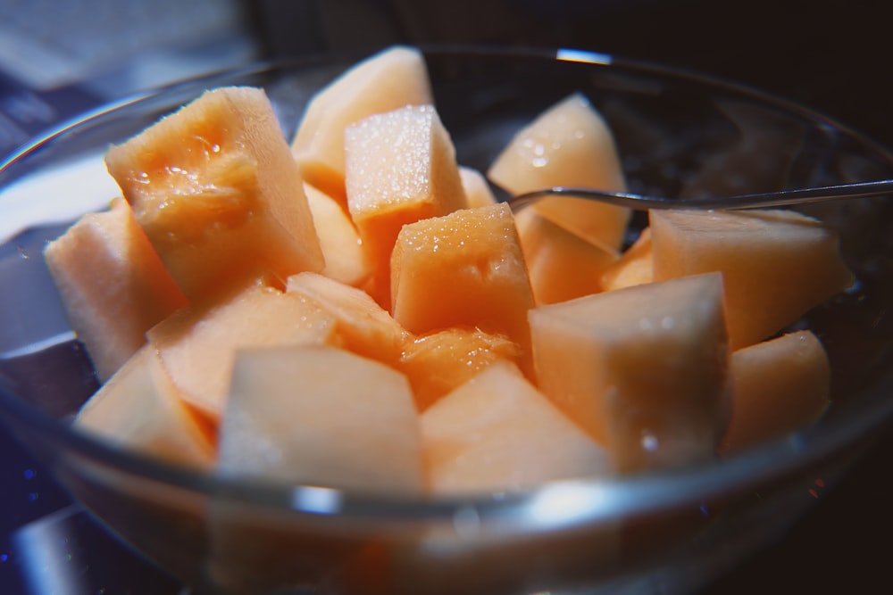 sliced cheese on clear glass bowl