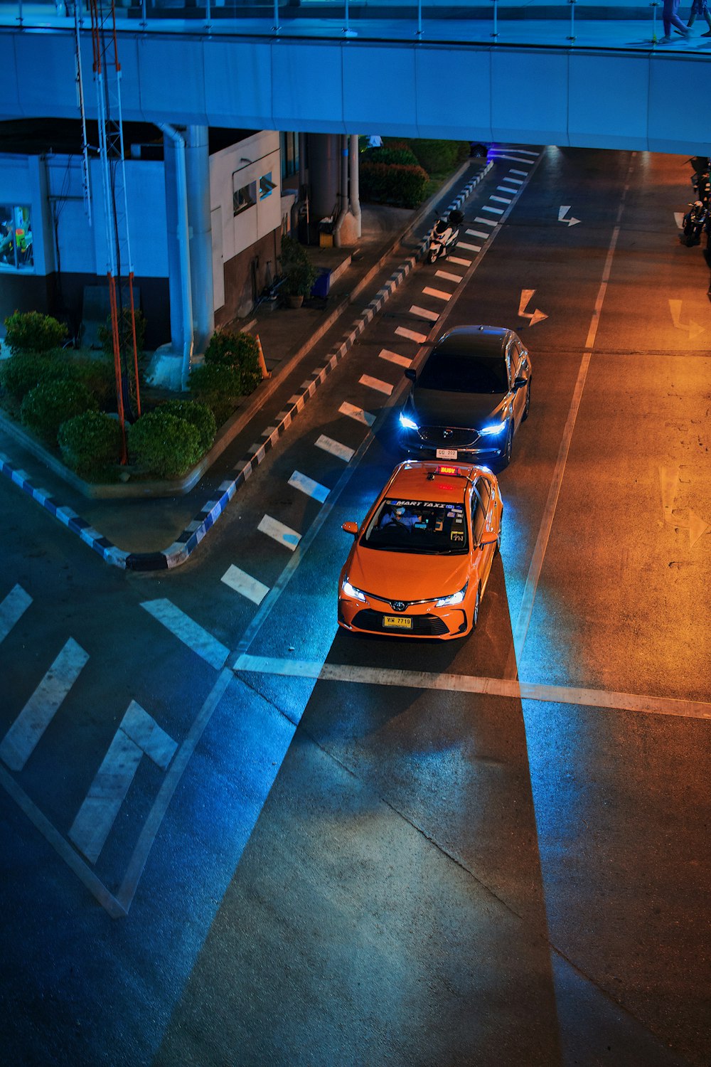 yellow car on road during night time