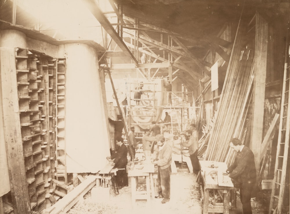 Men working on construction site building the Statue of Liberty