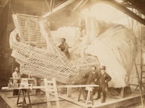 A construction team collaborating on a large-scale project, emphasizing teamwork and precision.