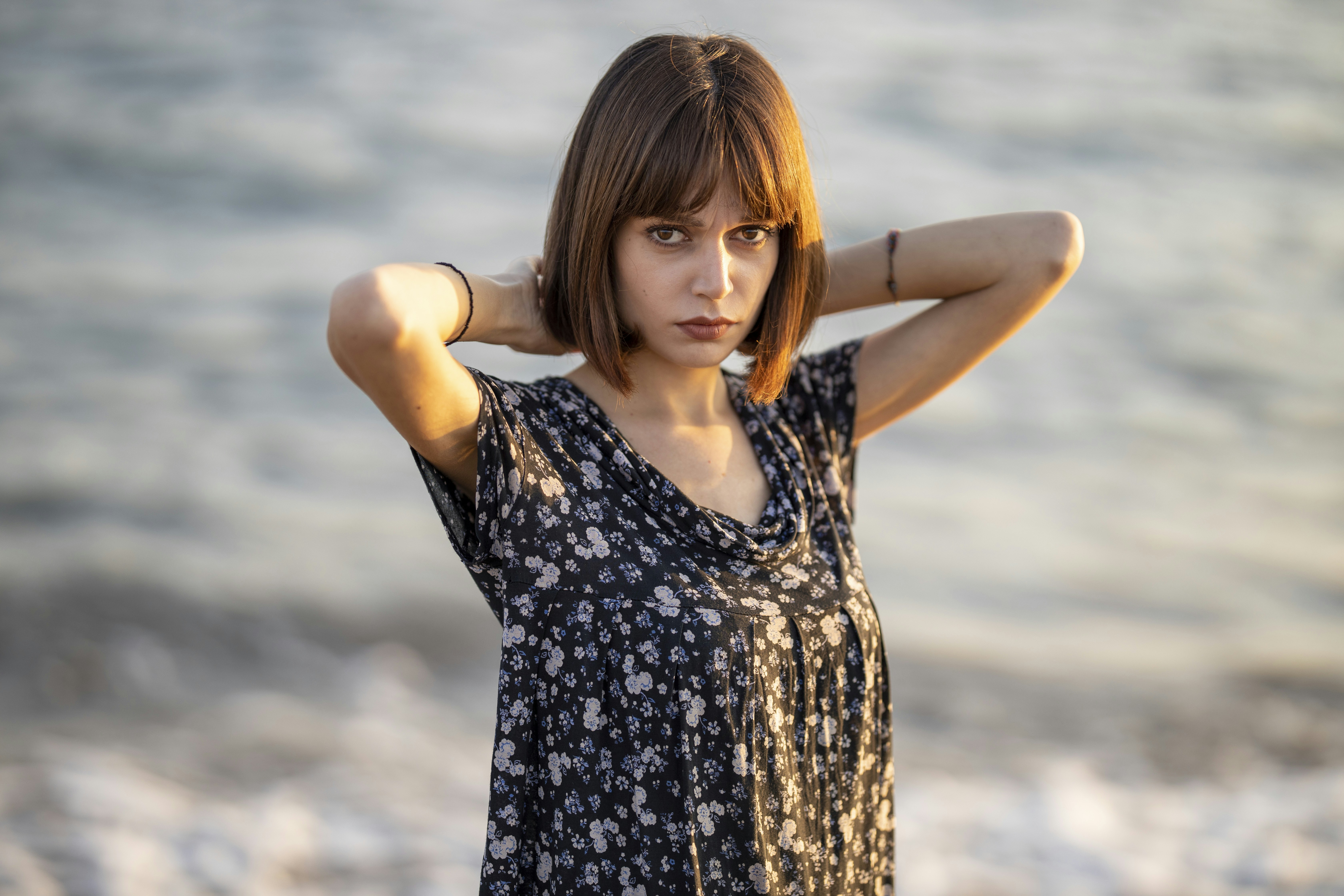 woman in black and white floral tank top