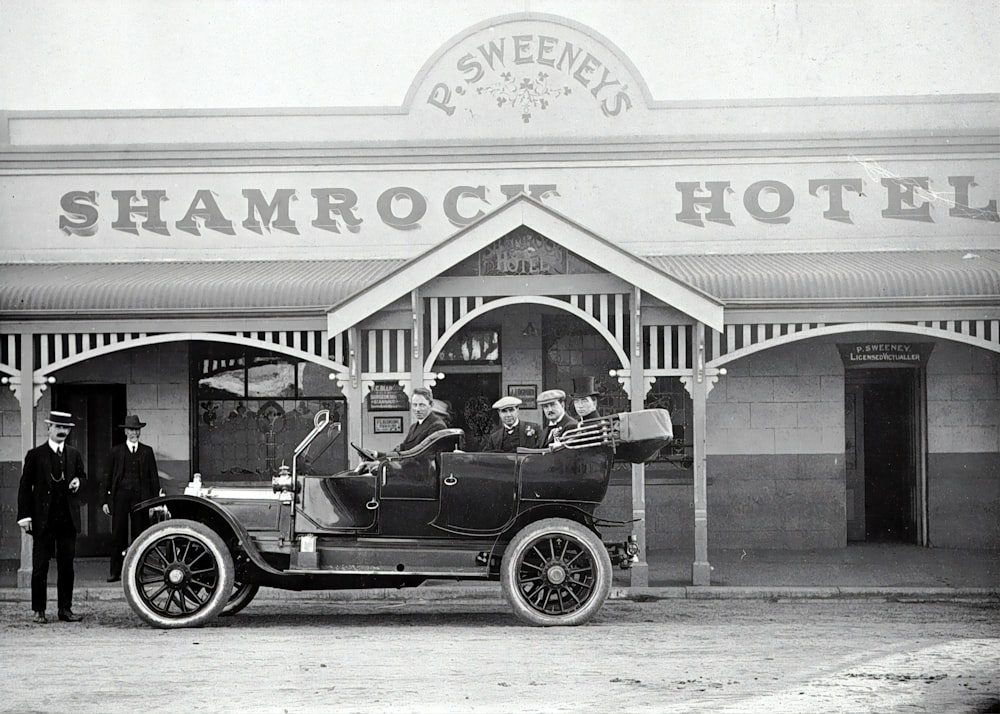 grayscale photo of vintage car