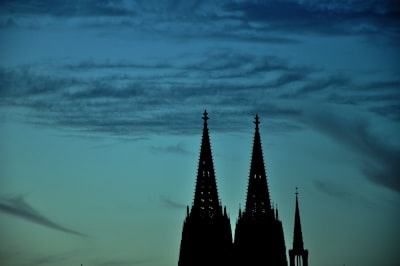 silhouette of tower under cloudy sky tower google meet background