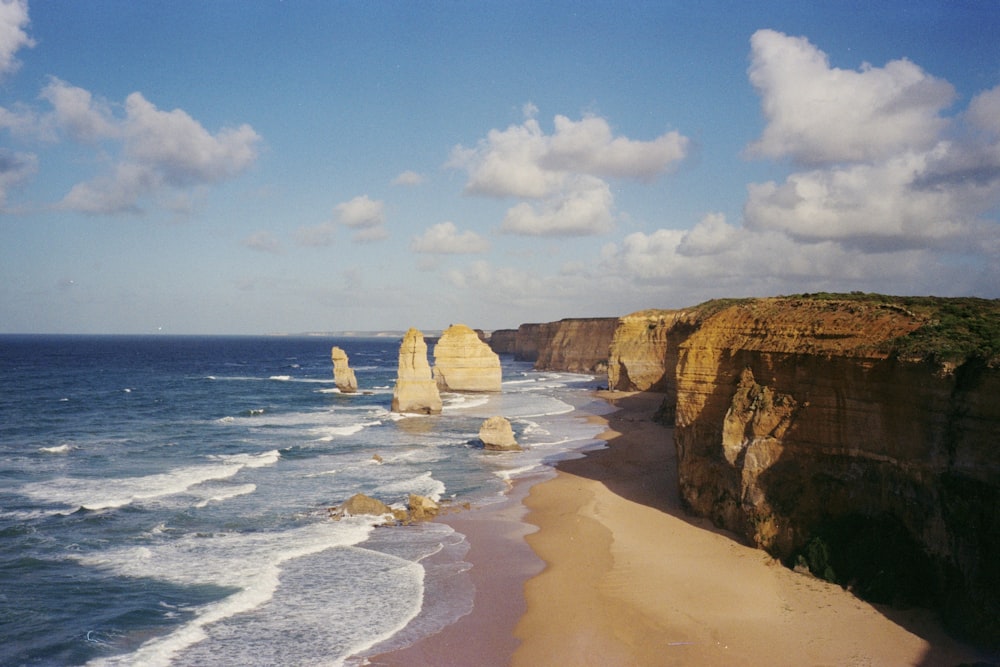 brown rock formation on sea shore during daytime