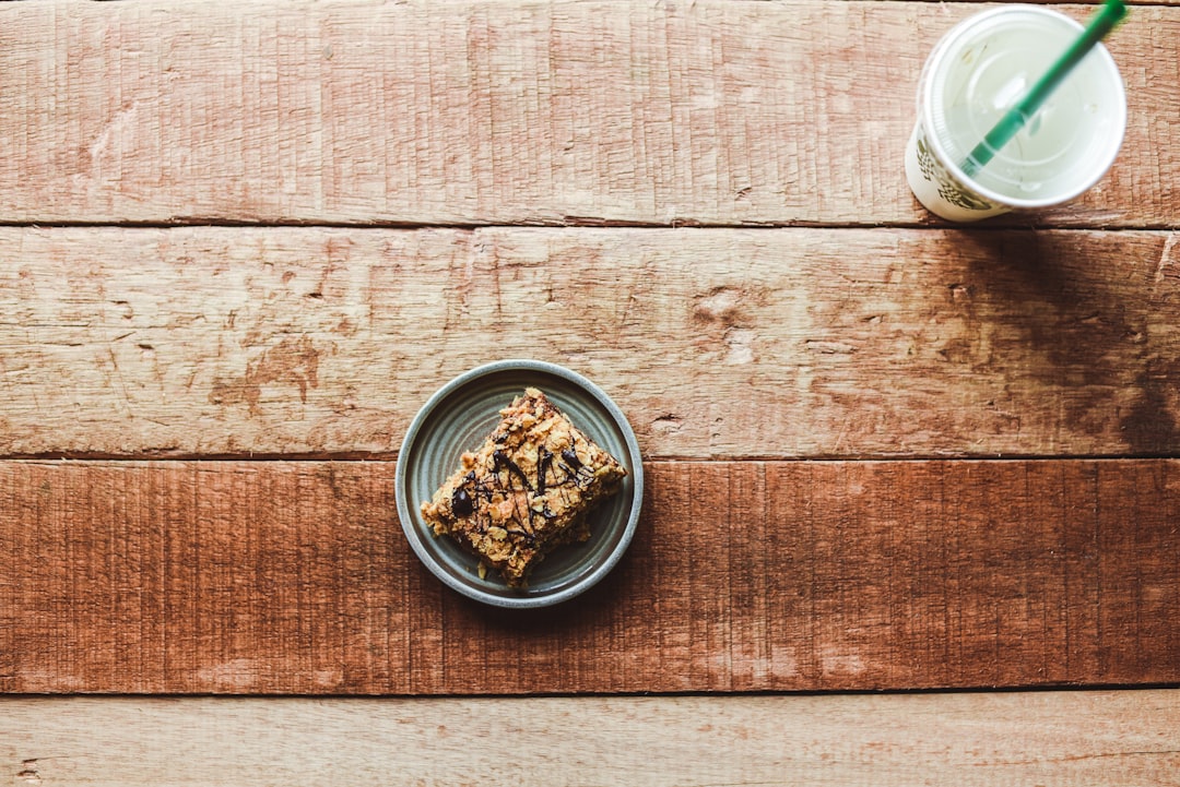 brown and black food in white round ceramic bowl