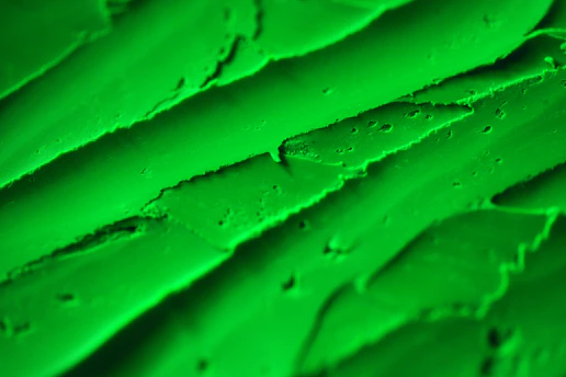 Close-up of a detailed 3D printed model showcasing layered textures and vibrant green accents.