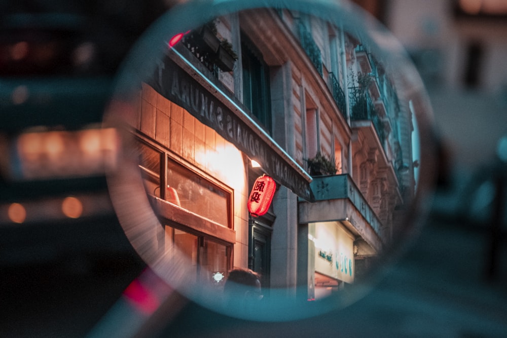 reflection of red and white building on mirror