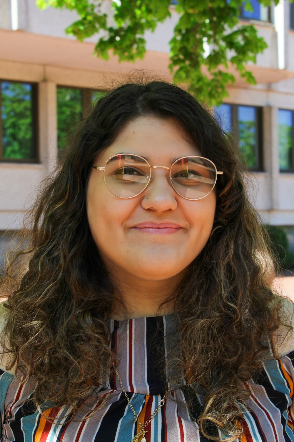 woman in black and red shirt wearing eyeglasses