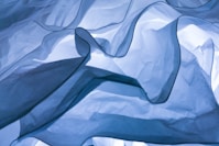 white textile on white textile
