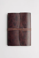 Leather-bound notebooks with subtle, embossed logos for a professional touch.
