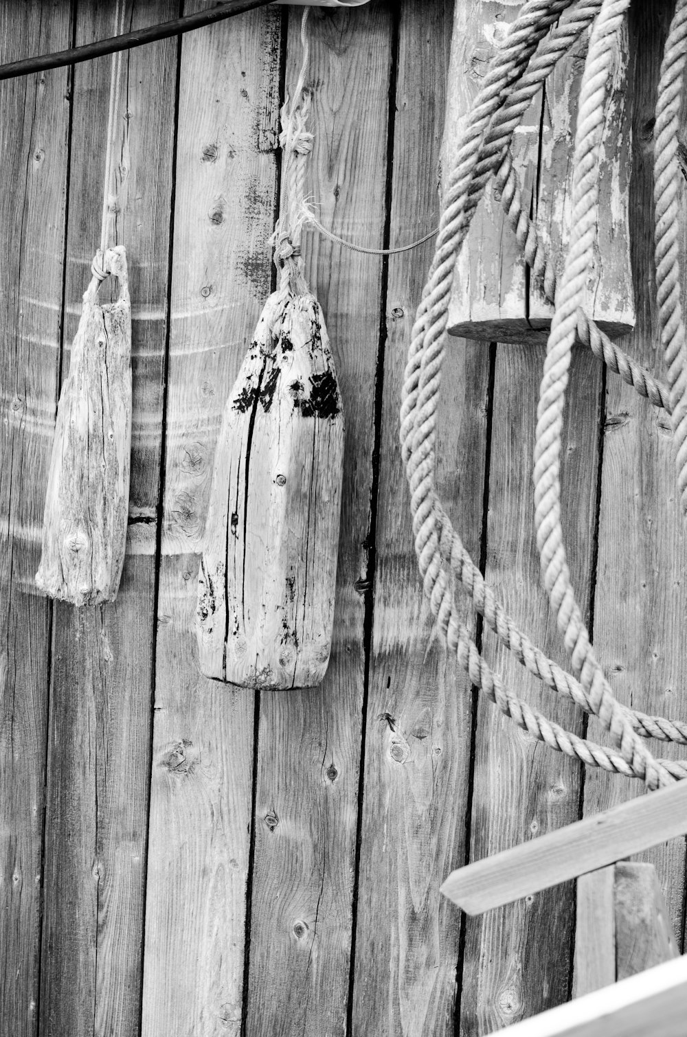 grayscale photo of wooden fence