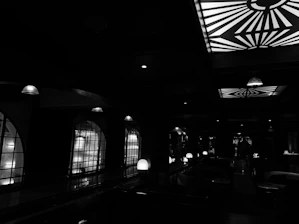 Sophisticated interior of a private social club with dim lighting and elegant decor.