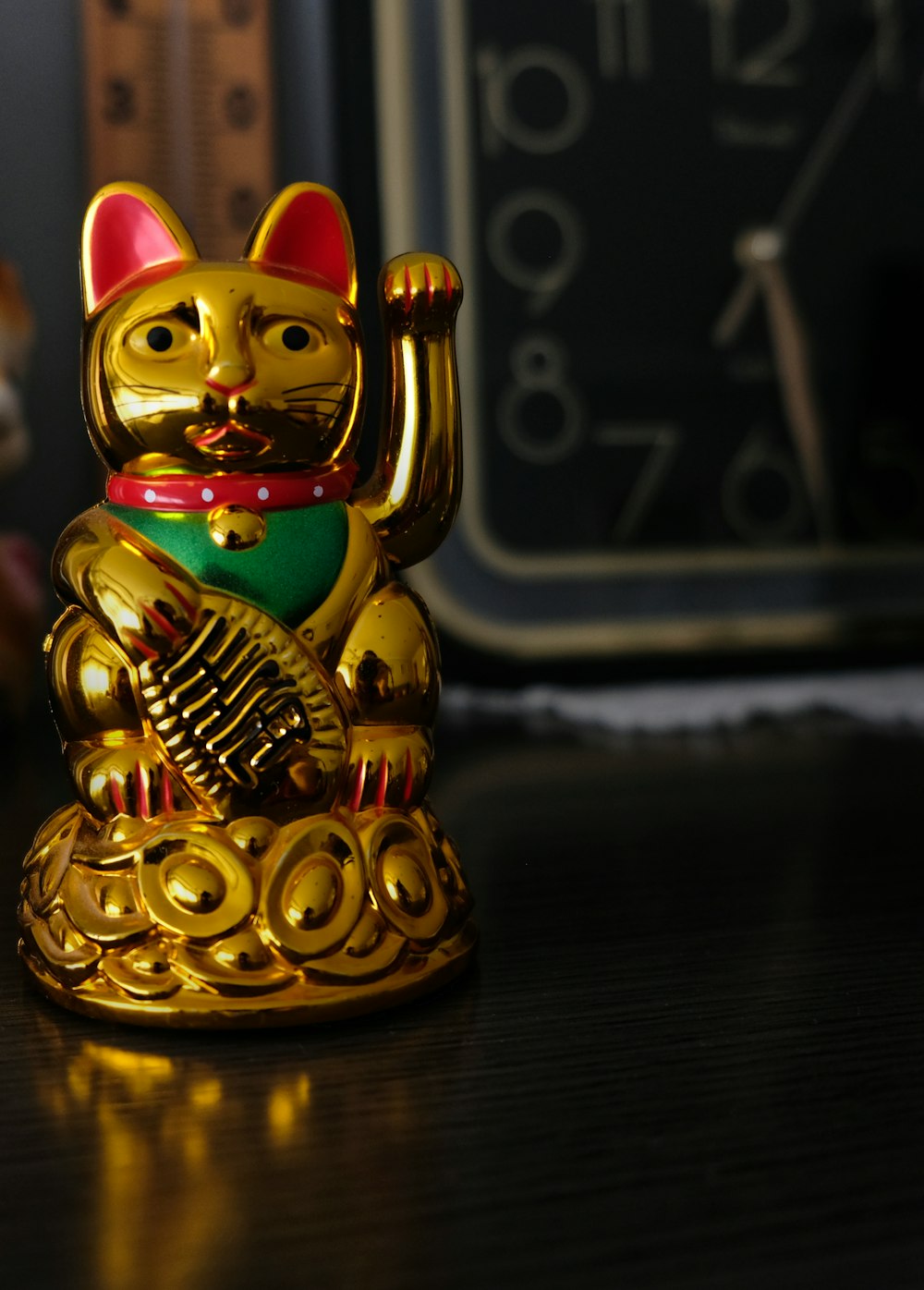 gold and green cat figurine