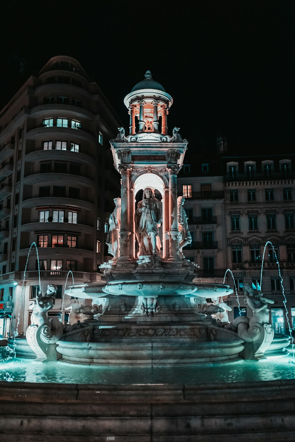 a statue in front of a building