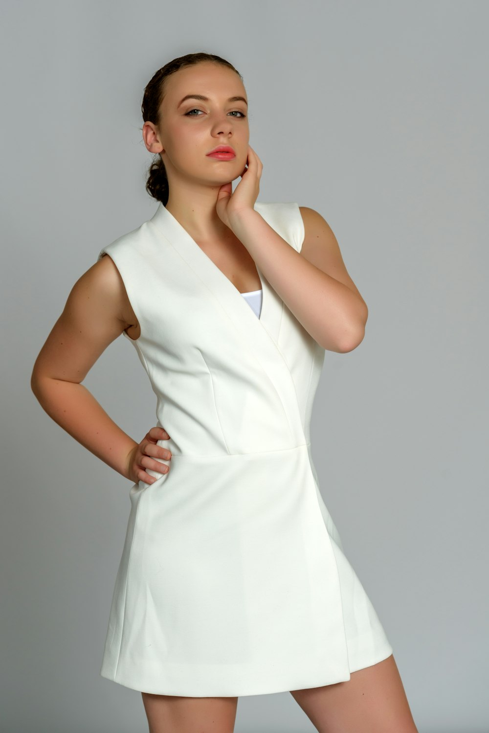 woman in white sleeveless dress