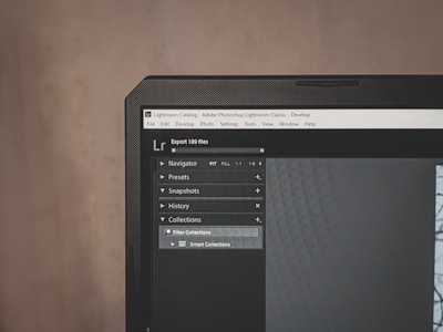 A computer monitor displays Adobe Lightroom Classic with a visible navigation panel on the left side. The interface includes options like Navigator, Presets, Snapshots, History, and Collections. A dark theme is applied, with a close-up focus on the top part of the screen, emphasizing the menu options and the title bar.