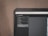 A computer monitor displays Adobe Lightroom Classic with a visible navigation panel on the left side. The interface includes options like Navigator, Presets, Snapshots, History, and Collections. A dark theme is applied, with a close-up focus on the top part of the screen, emphasizing the menu options and the title bar.