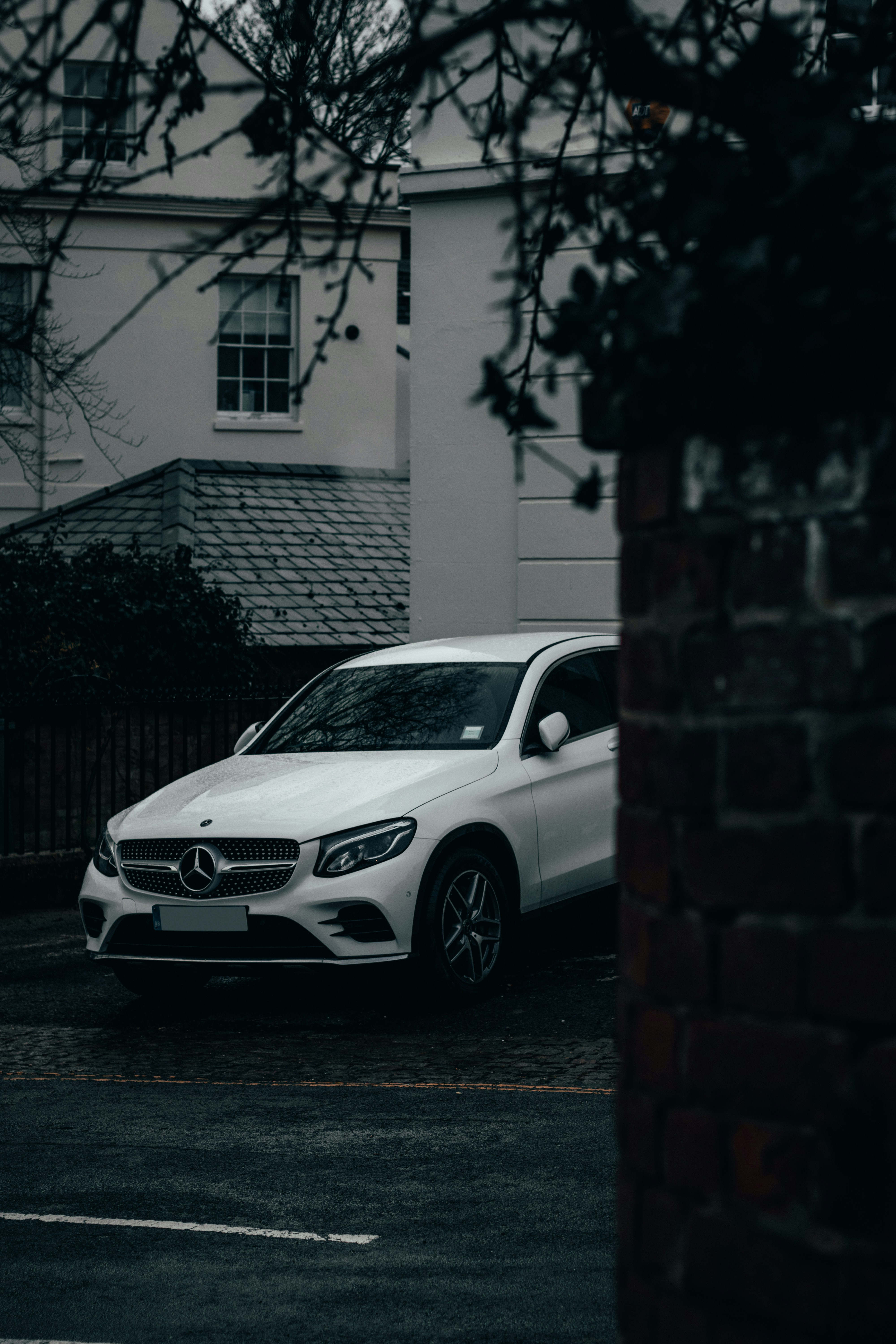 White Mercedes Benz C Class Parked Beside Brick Wall Photo Free Grey Image On Unsplash