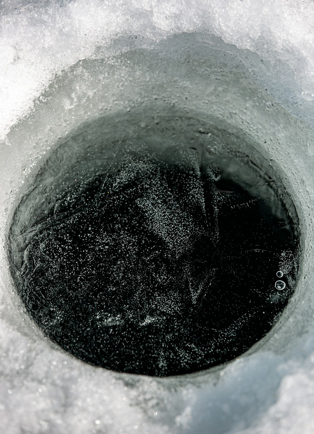 black liquid in gray concrete container
