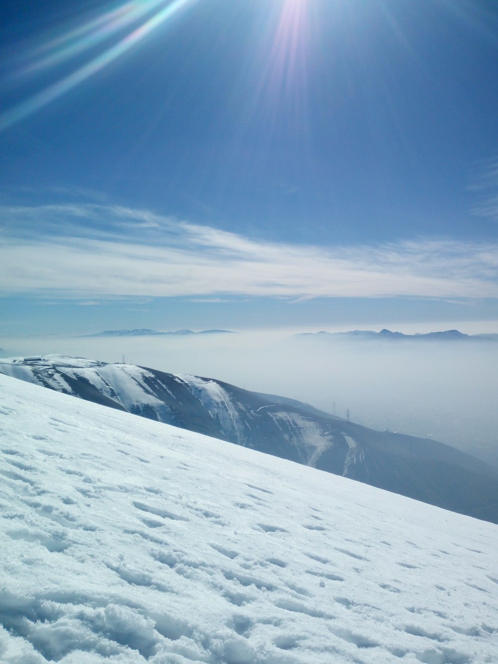 snow covered mountain under blue sky during daytime