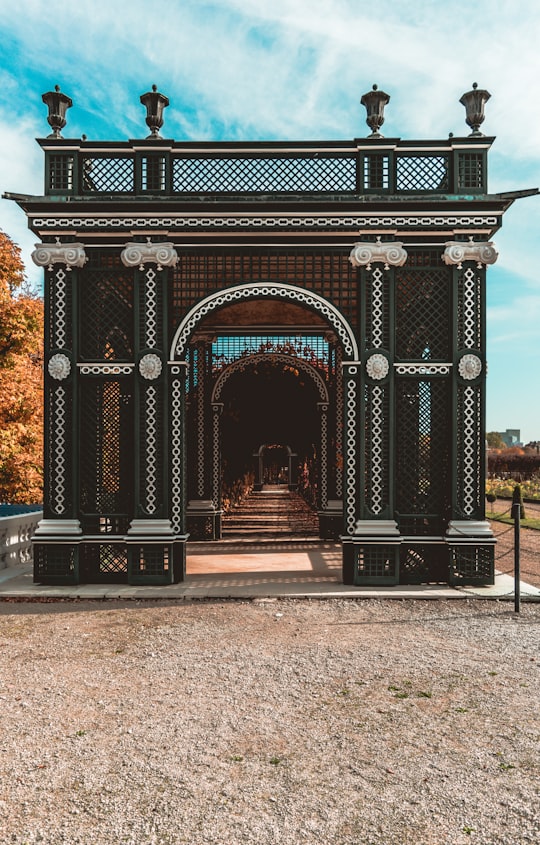 brown and black arch gate in Schönbrunner Schloss Park Austria