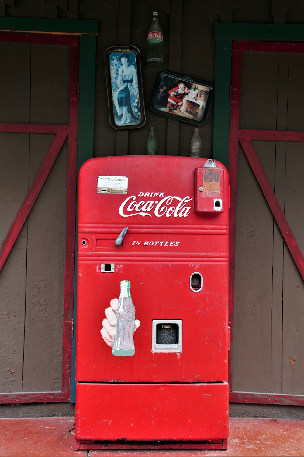 coca cola soda bottle on red coca cola vending machine