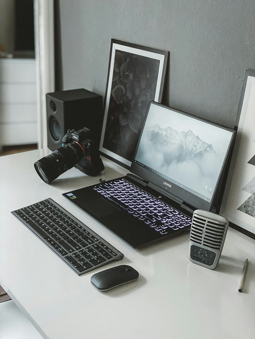 macbook pro beside black and silver cordless computer mouse